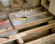 Floor insulation in a wooden house from below